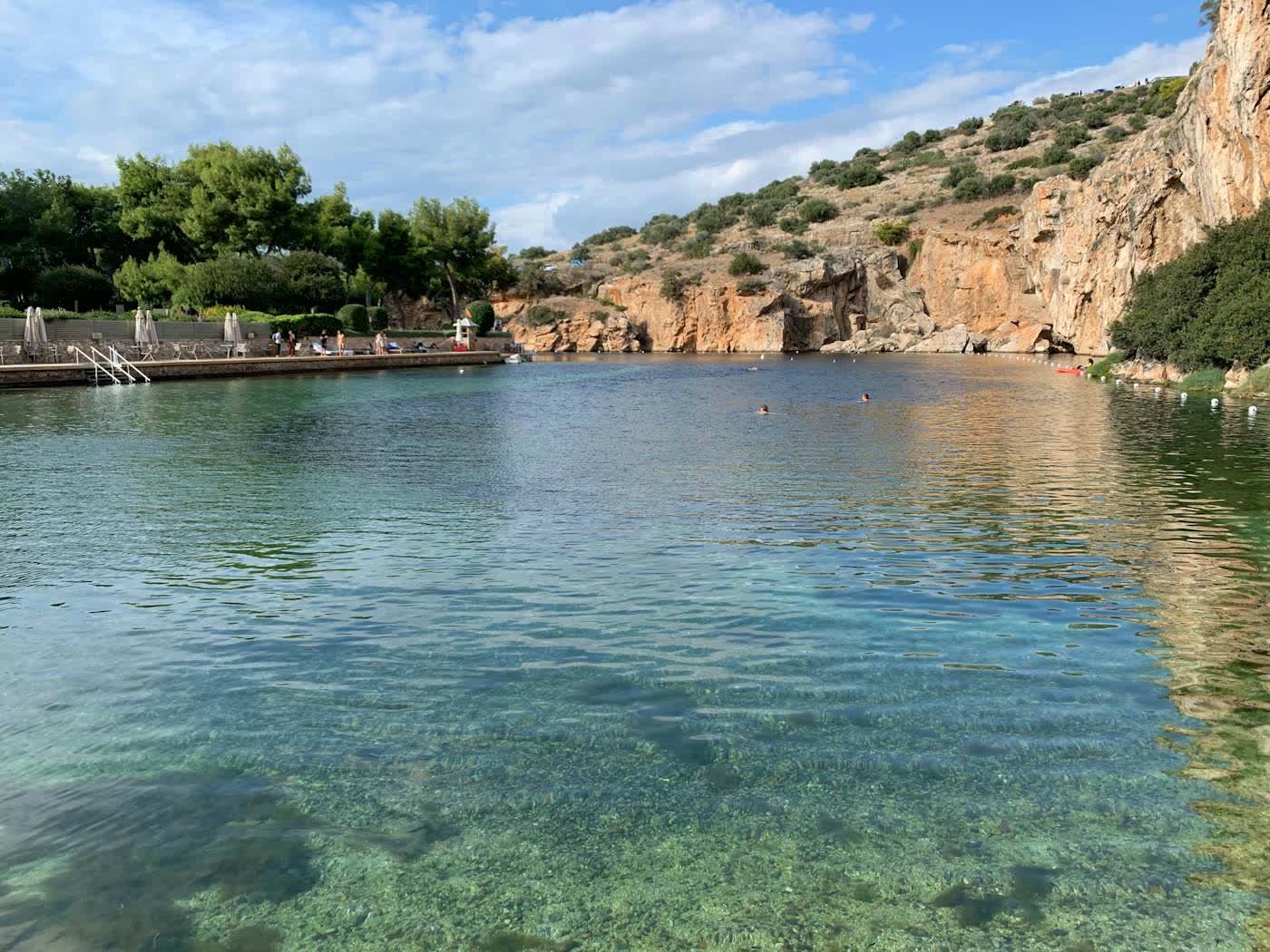 Lake Vouliagmeni, clear water under a cliff